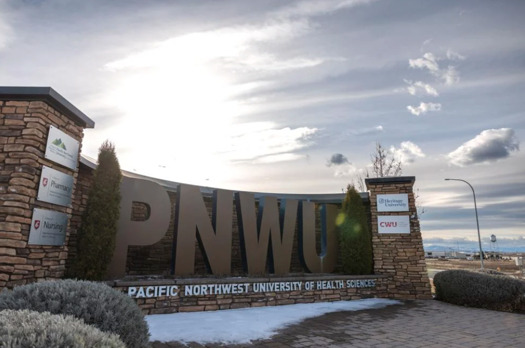 The sign for Pacific Northwest University of Health Sciences is seen off University Parkway in the Terrace Heights neighborhood of Yakima, Wash., Wednesday, Mar. 1, 2023. PNWU has been significant in bringing development to the Terrace Heights area.