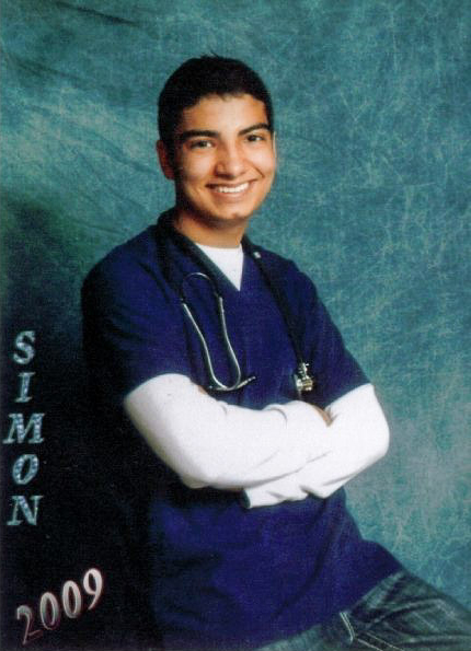 Simon Mendoza at age 17 as a Certified Nurse Assistant.