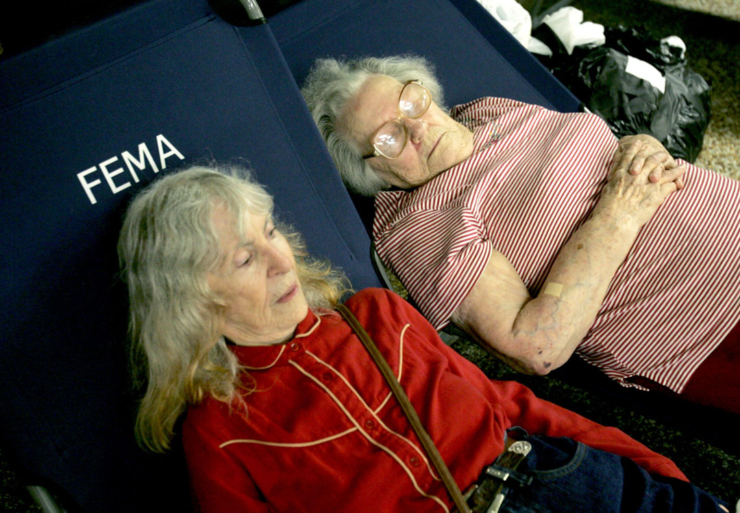 Photo of two elderly women recovering at the FEMA shelter in Houma, LA