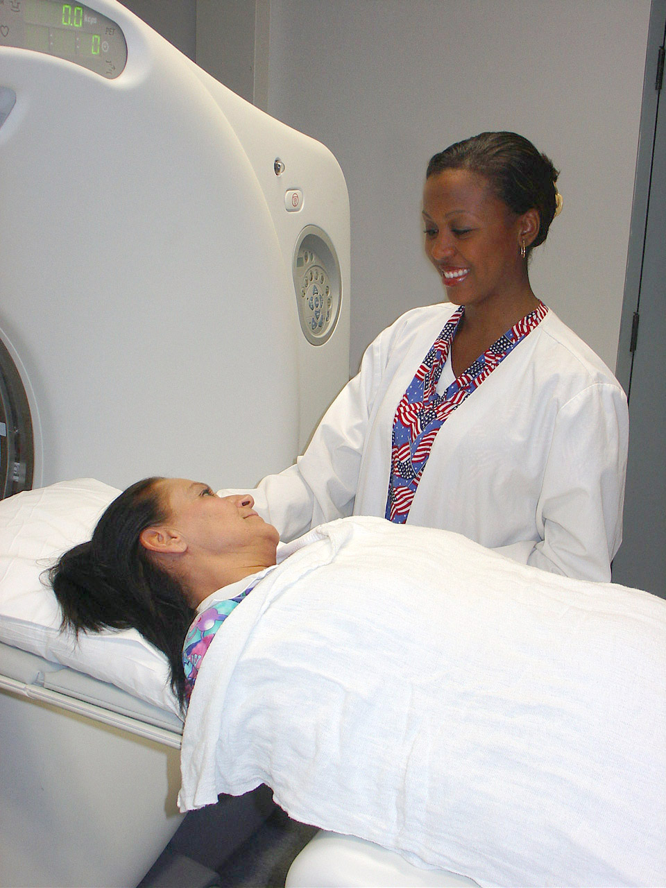 Gwen with the PET/CT scanner and a patient. 