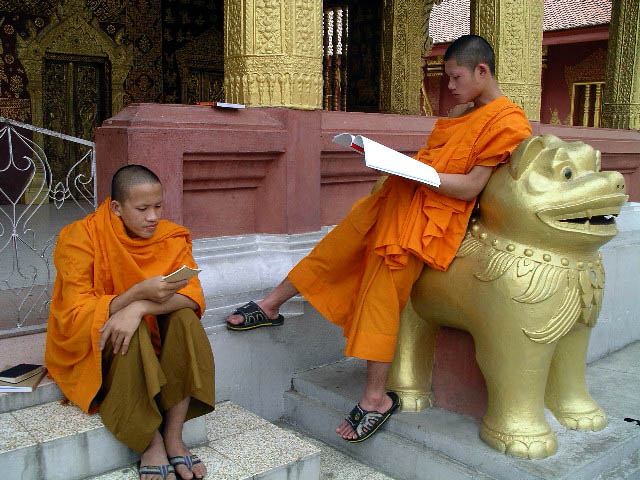 Young monks studying outside the temple in Luong Prabang.