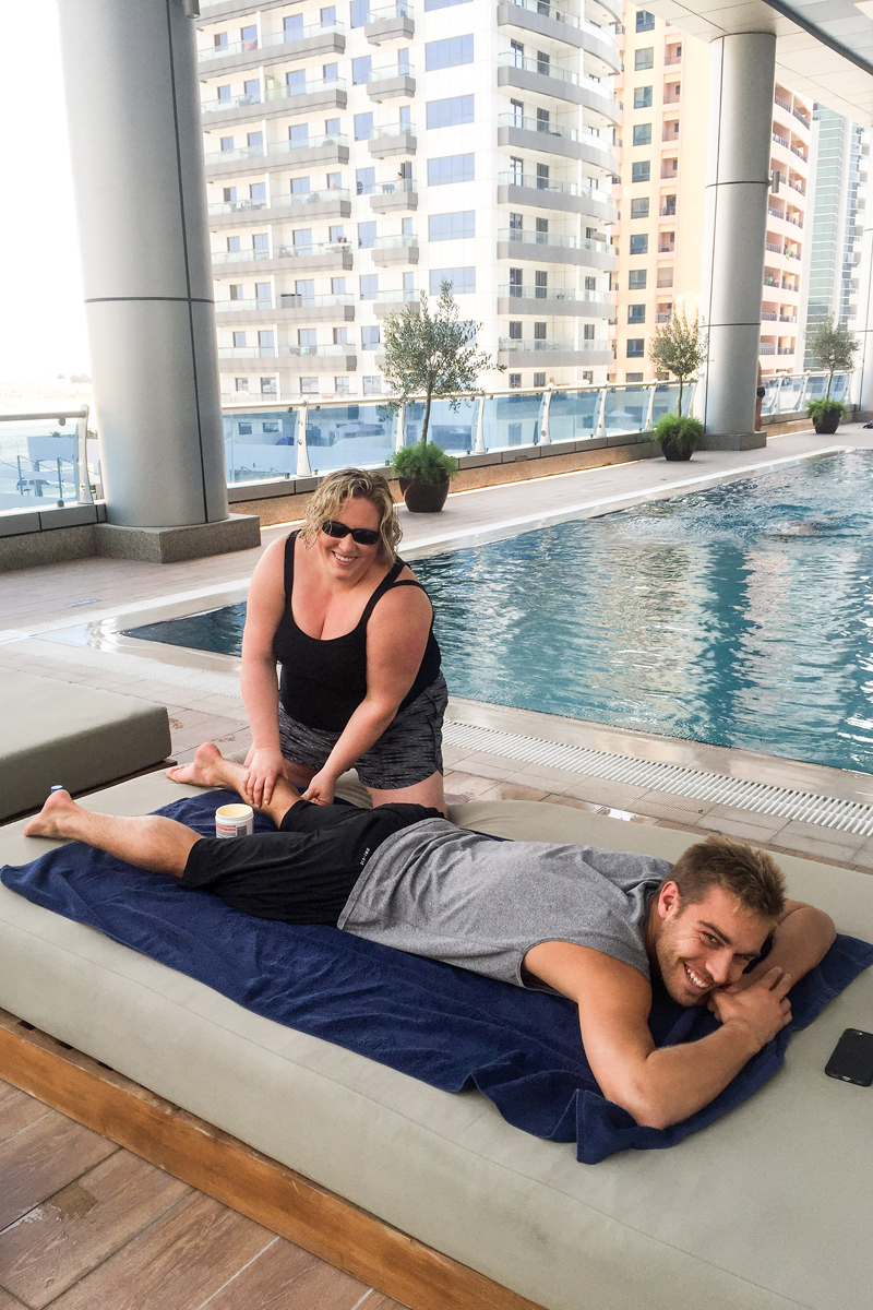 Jen providing treatment to Kristian Ipsen by the hotel pool in Dubai.