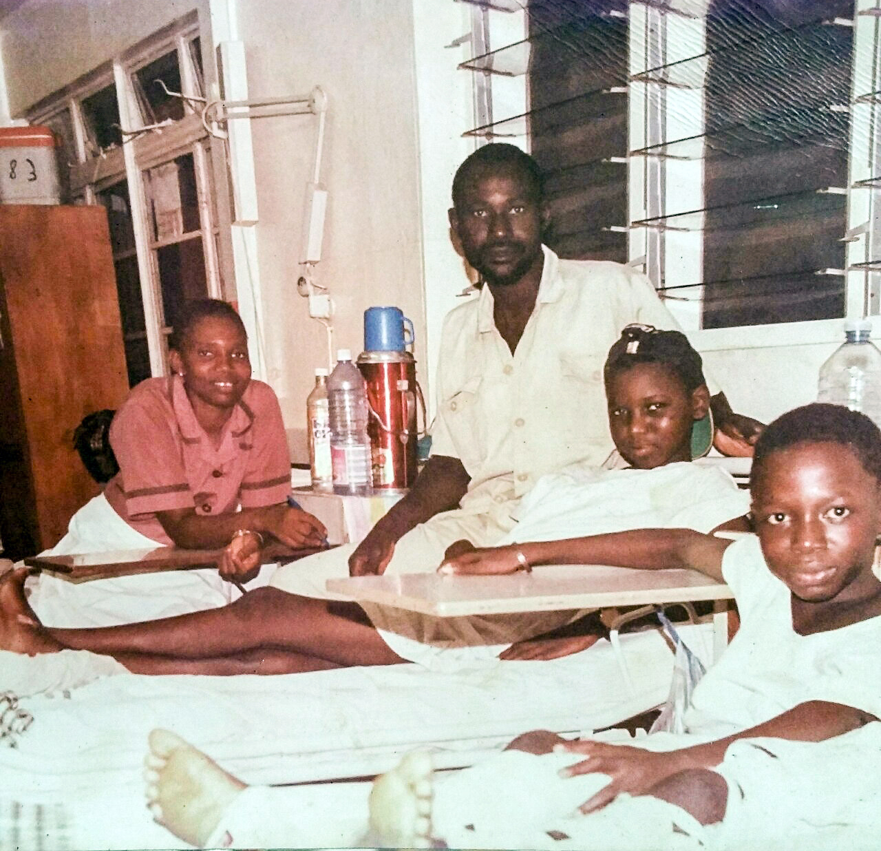 Ismail (second from left) at age 13 in a Gambia hospital recovering from a fractured femur, an injury that was to follow him into adulthood. At the far right is his nurse, and the hospital custodian. At the right is his bed neighbor.