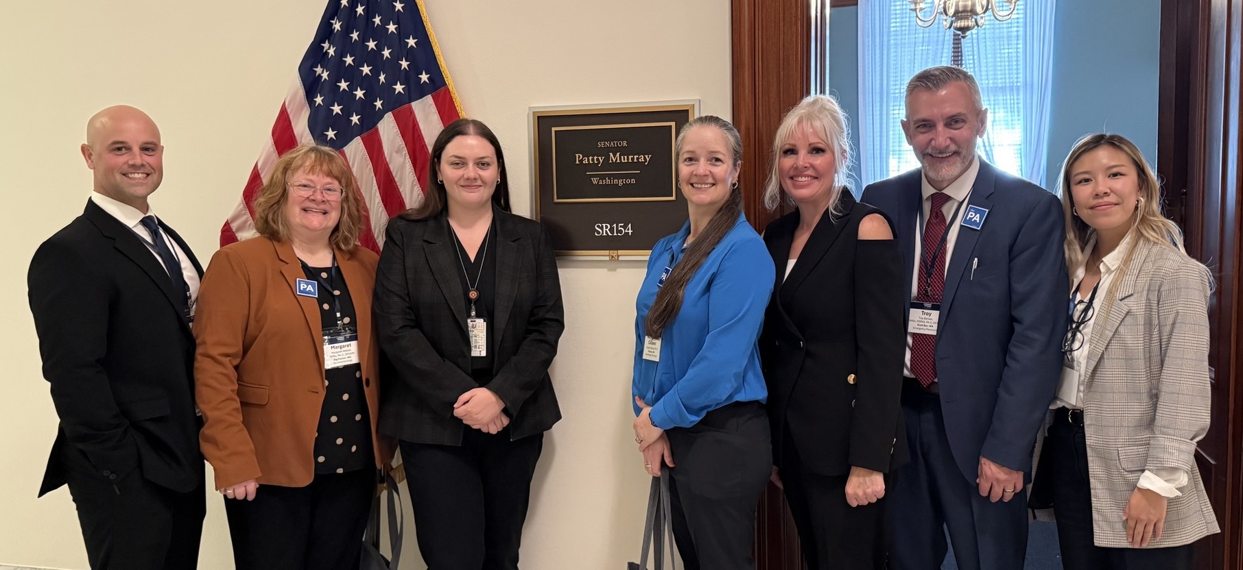 A group of colleagues posing outside Sen. Patty Murray's D.C. office