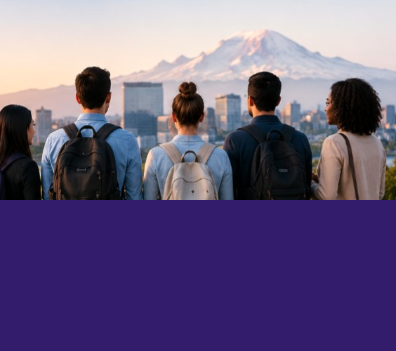 A group of students looking out over a cityscape with mountain in the background